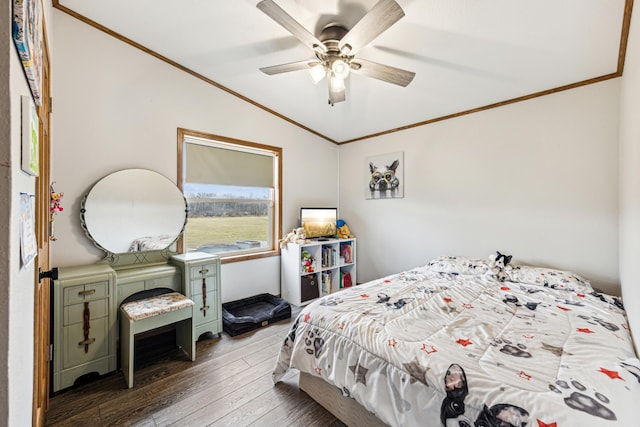 bedroom with ceiling fan, dark hardwood / wood-style flooring, crown molding, and vaulted ceiling