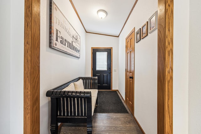 doorway to outside featuring ornamental molding, lofted ceiling, and wood-type flooring