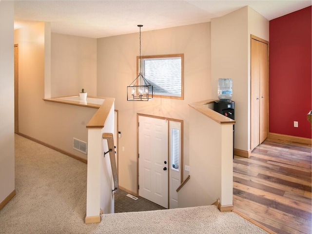 3781 Willowwood St SW, Prior Lake, MN 55372 - entrance foyer with a chandelier and wood finished floors