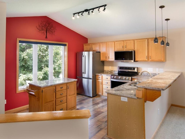 3781 Willowwood St SW, Prior Lake, MN 55372 - kitchen with stainless steel appliances, a peninsula, vaulted ceiling, light stone countertops, and hanging light fixtures