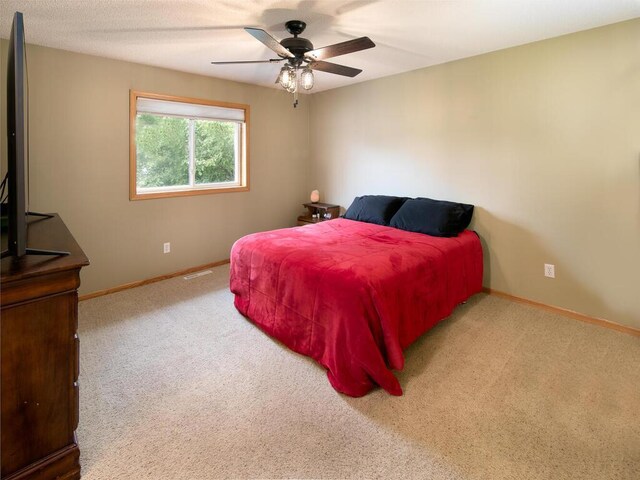 3781 Willowwood St SW, Prior Lake, MN 55372 - carpeted bedroom featuring baseboards and ceiling fan
