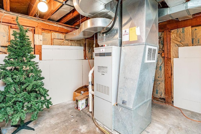 utility room featuring heating unit