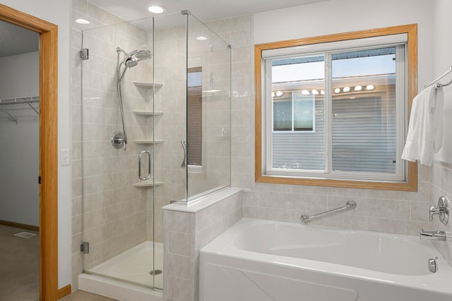 bathroom with independent shower and bath