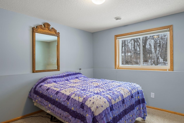 carpeted bedroom with a textured ceiling