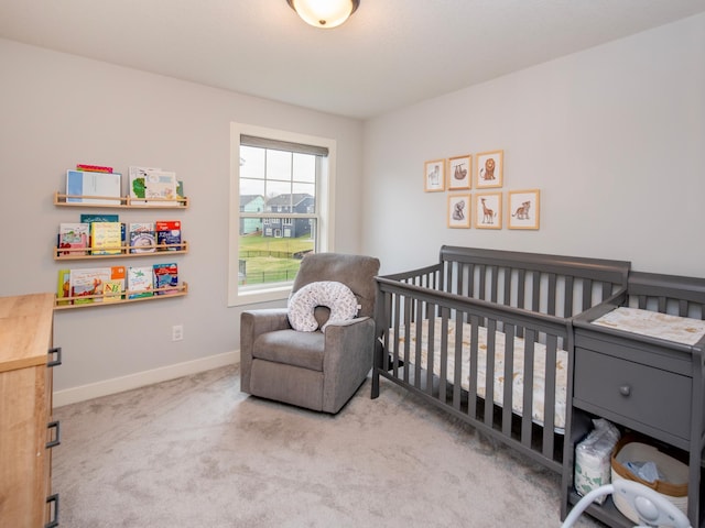 carpeted bedroom with a crib