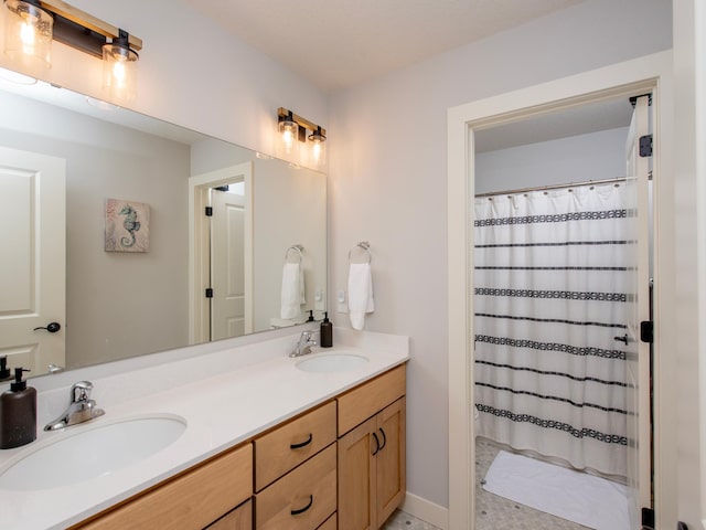 bathroom featuring a shower with shower curtain and vanity