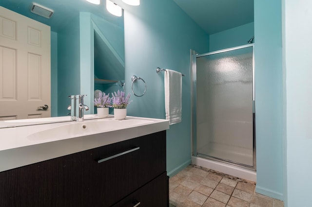 bathroom with vanity and walk in shower