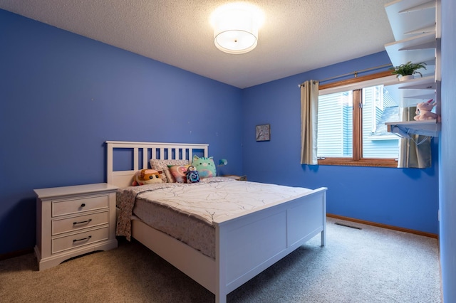 carpeted bedroom with a textured ceiling