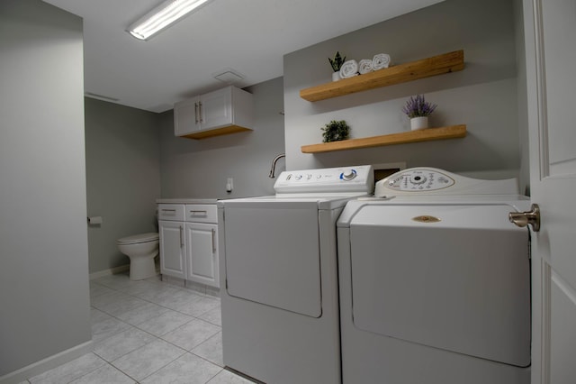 laundry room with light tile patterned flooring and independent washer and dryer