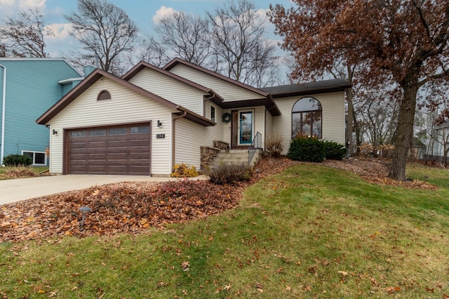 single story home with a front yard and a garage