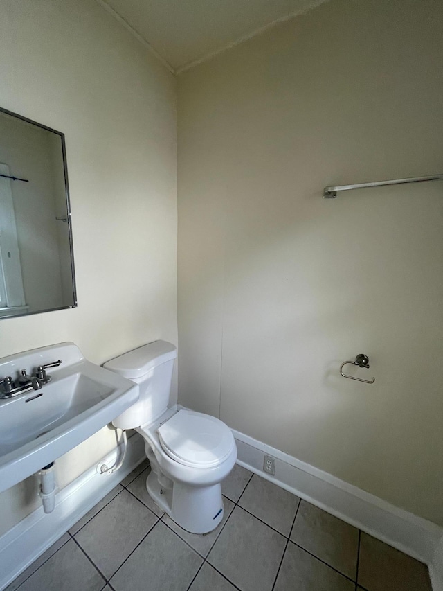 bathroom with tile patterned flooring and toilet