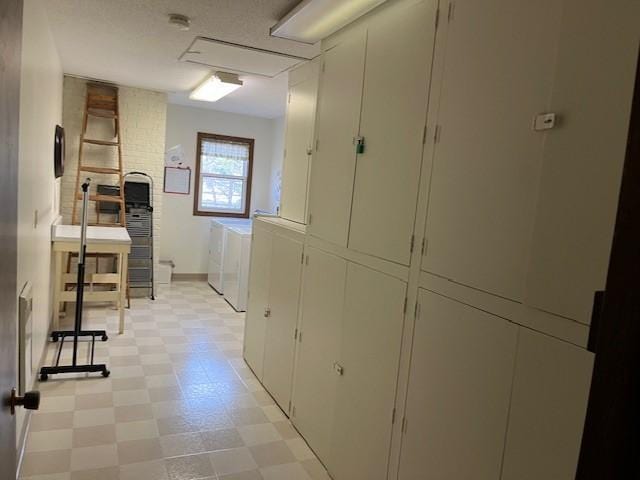 laundry area featuring washing machine and clothes dryer