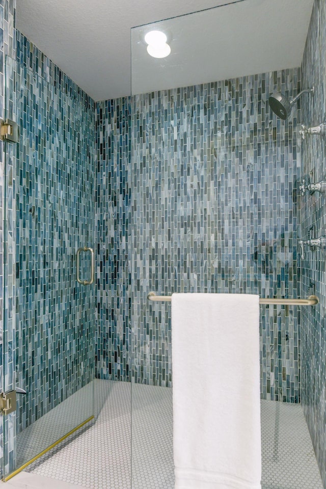 full bathroom with a shower stall