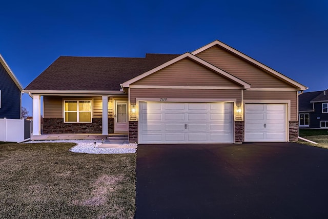 ranch-style home featuring a garage