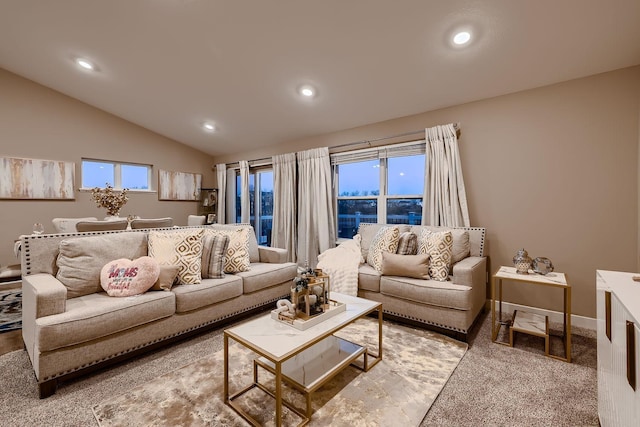 living room with carpet flooring, lofted ceiling, and a wealth of natural light