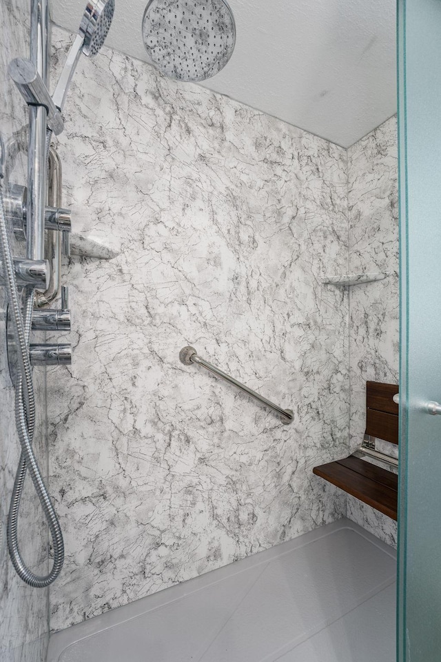 bathroom with a tile shower