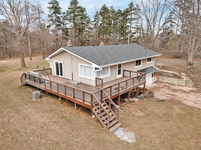 back of property featuring a wooden deck and central AC unit