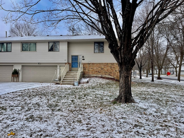 split foyer home featuring a garage