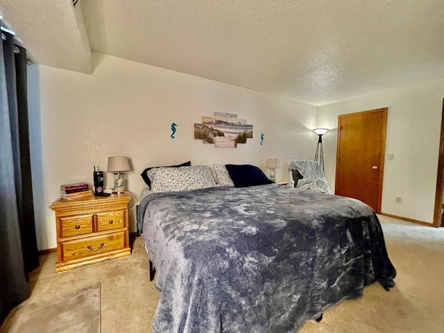 carpeted bedroom with a textured ceiling