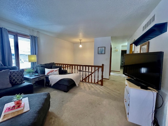 carpeted bedroom with a textured ceiling