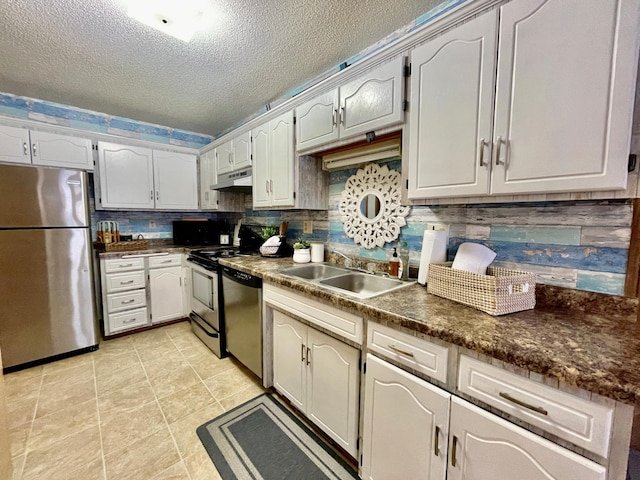 kitchen featuring white cabinetry, decorative backsplash, sink, and stainless steel appliances