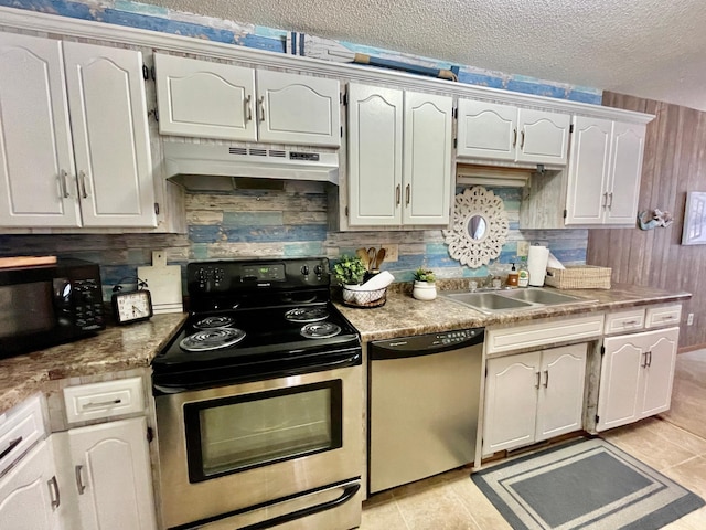 kitchen featuring decorative backsplash, sink, white cabinetry, and stainless steel appliances