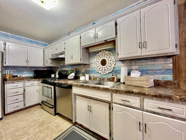 kitchen featuring white cabinetry, sink, stainless steel appliances, backsplash, and a textured ceiling