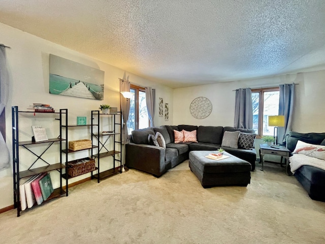 living room with light carpet and a textured ceiling