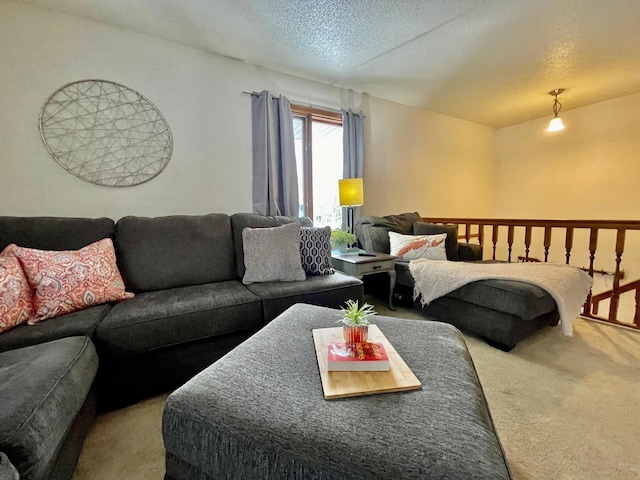 living room with carpet floors and a textured ceiling