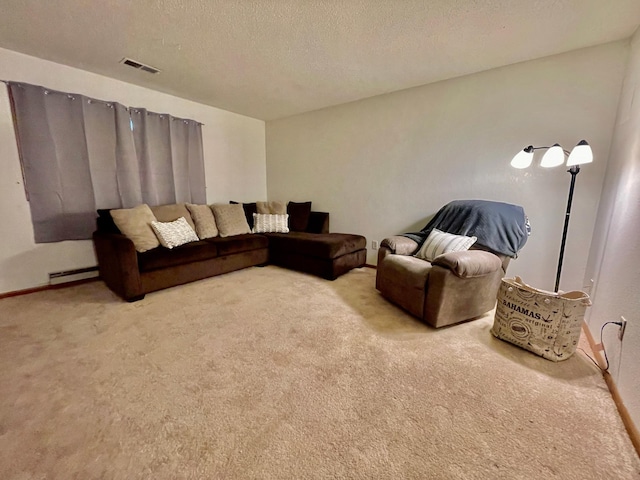 living room featuring light colored carpet, a textured ceiling, and a baseboard heating unit