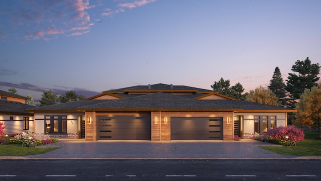 prairie-style home featuring a garage