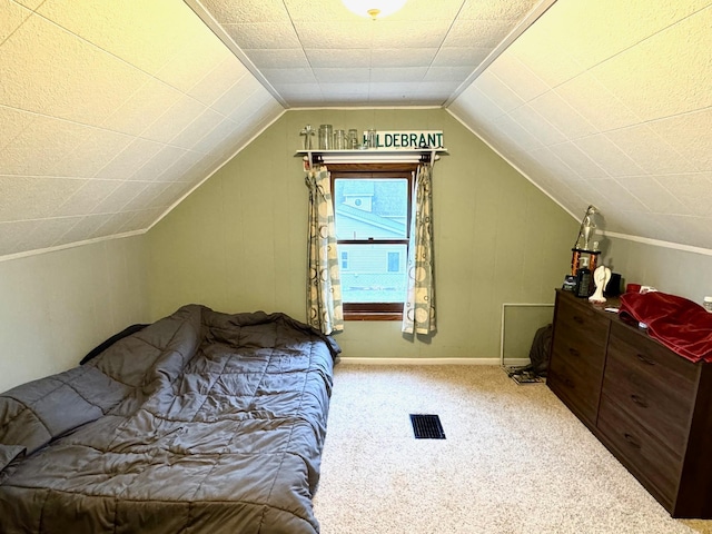 carpeted bedroom with vaulted ceiling