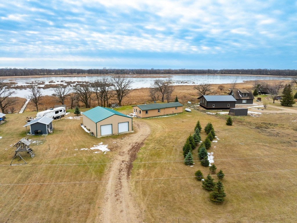 birds eye view of property with a water view