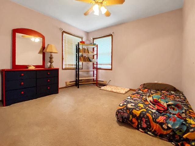 carpeted bedroom with ceiling fan