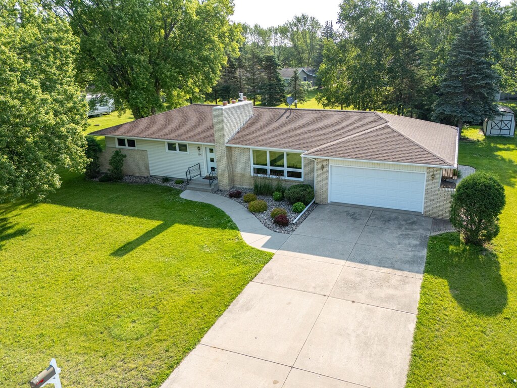 104 Ash St NE, Fertile, MN 56540 - ranch-style home with a garage and a front lawn