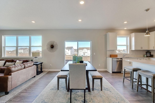 dining space featuring dark hardwood / wood-style floors and sink