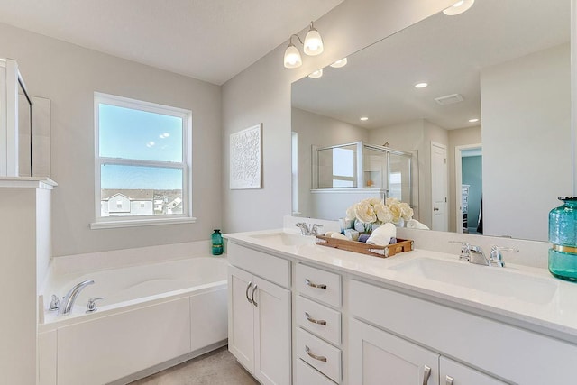 bathroom featuring separate shower and tub and vanity