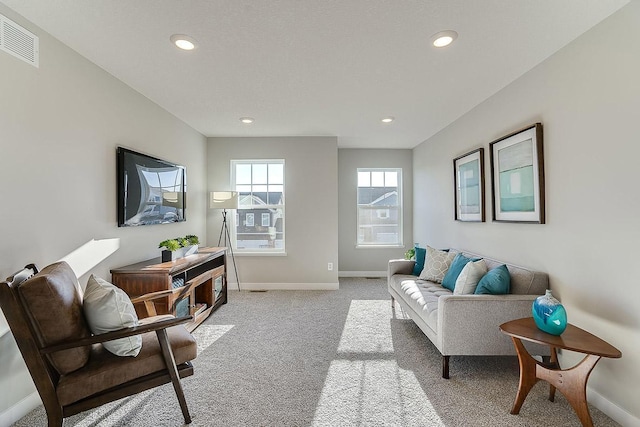 living room featuring light carpet