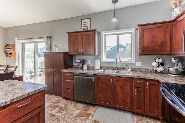 kitchen featuring hanging light fixtures, sink, and appliances with stainless steel finishes