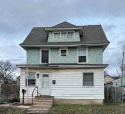 front facade with a front lawn