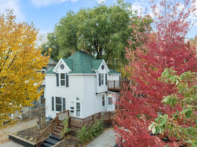 back of property featuring a deck