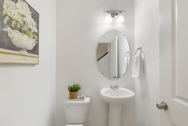 bathroom featuring sink and toilet