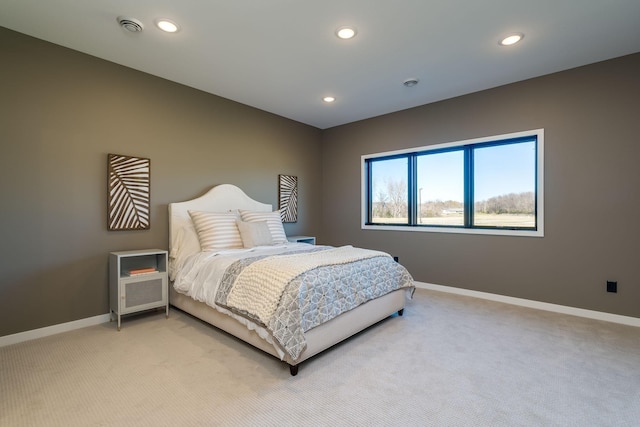 bedroom with light carpet