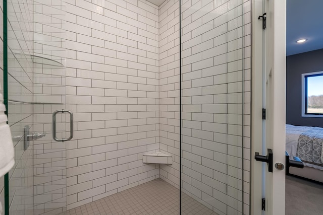 bathroom with a shower with shower door