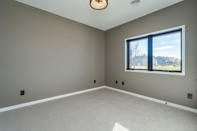 empty room featuring light colored carpet