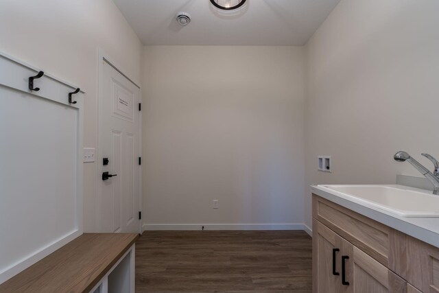 interior space with sink and hardwood / wood-style flooring