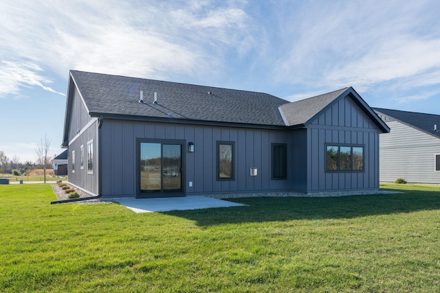 rear view of house featuring a patio area and a yard