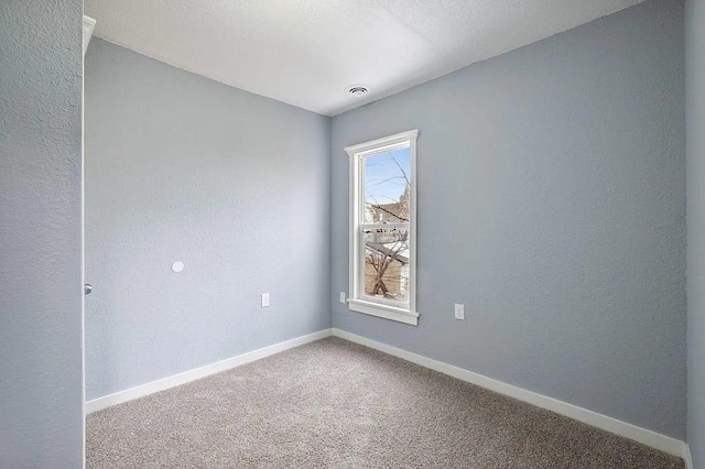 empty room featuring carpet