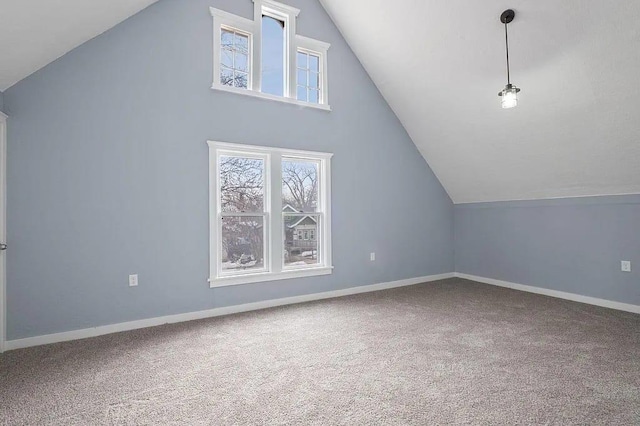 bonus room featuring lofted ceiling and carpet floors