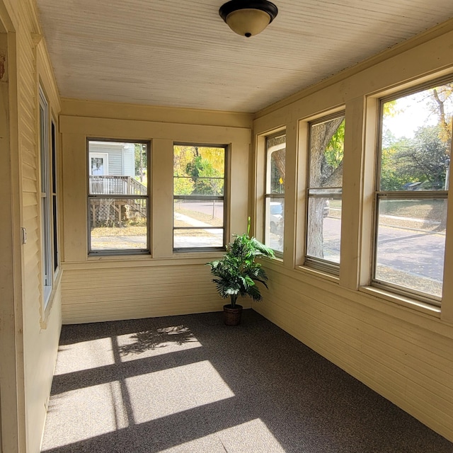 unfurnished sunroom featuring plenty of natural light